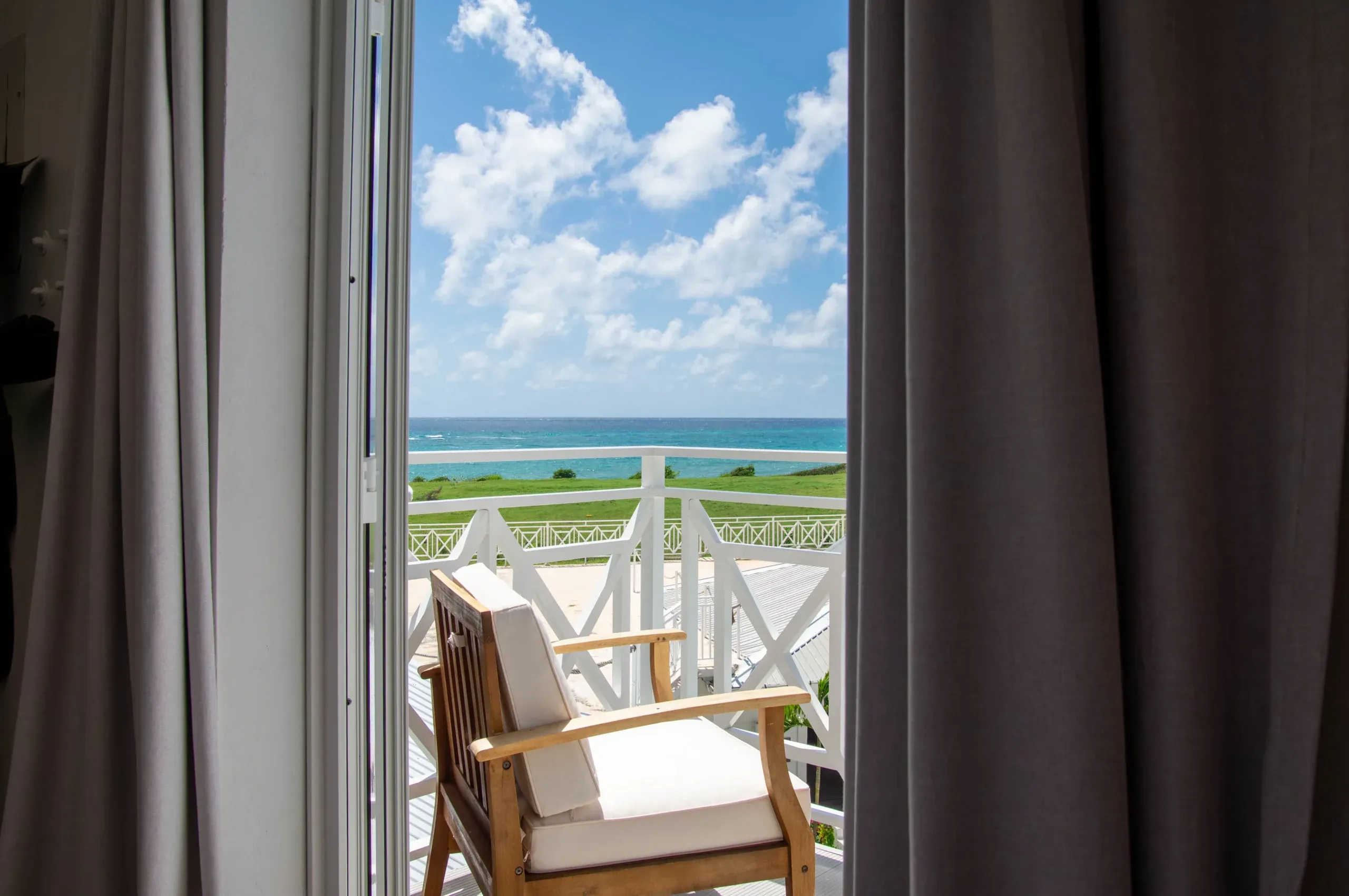 The balcony of the King Ocean view suite, overlooking the ocean and hotel grounds.