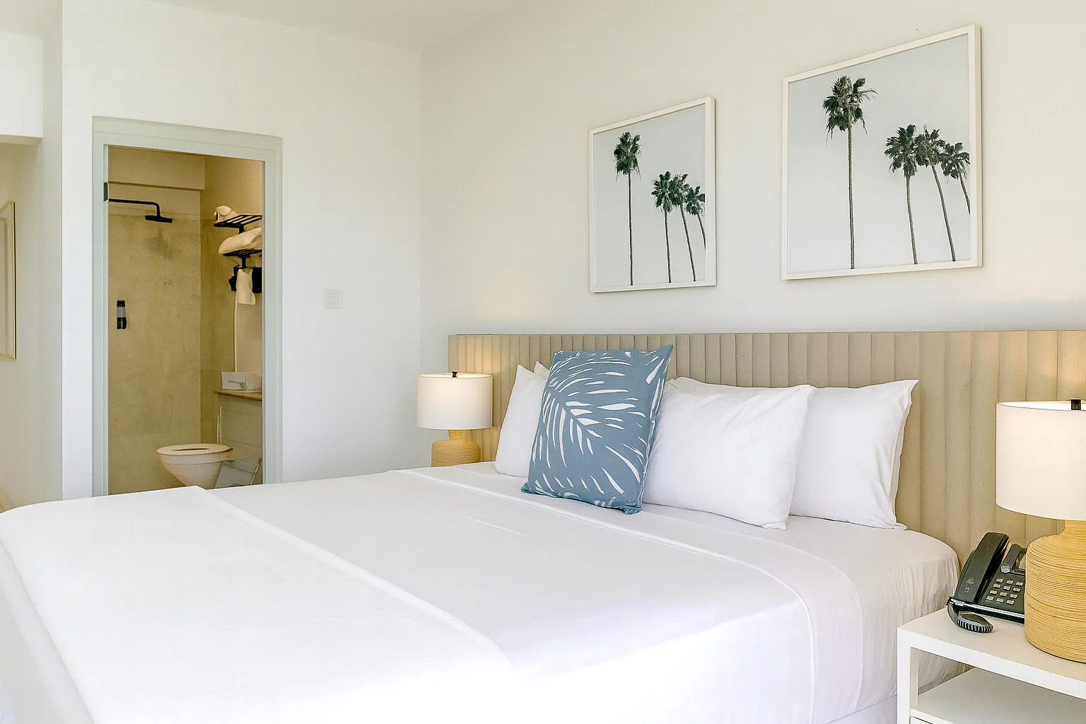 Ocean View King Suite at South Point Hotel Barbados featuring a king bed, tropical decor, and natural light.